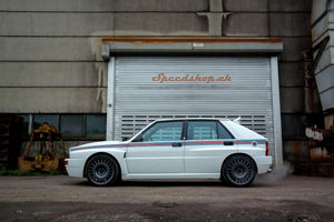 Lancia Delta HF integrale with the exclusive Speedshop.ch Martini 6.5 livery giving the car a sleek and nice look