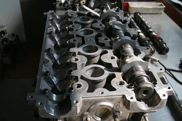CNC machined Cylinder Head for Lancia Delta HF integrale. Blueprinted and ported flowbench tested for maximum Volumetric Efficiency. Bespoke intake and exhaust camshaft kit.